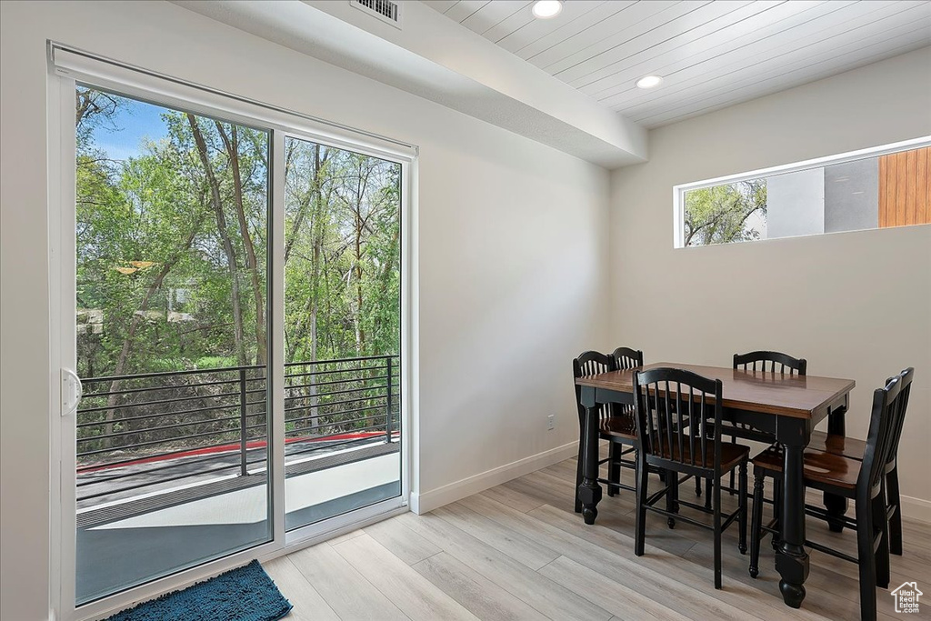 Dining area with recessed lighting, wooden ceiling, light wood-style floors, baseboards, and visible vents