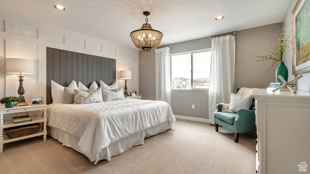 Bedroom featuring baseboards, recessed lighting, a notable chandelier, and light colored carpet