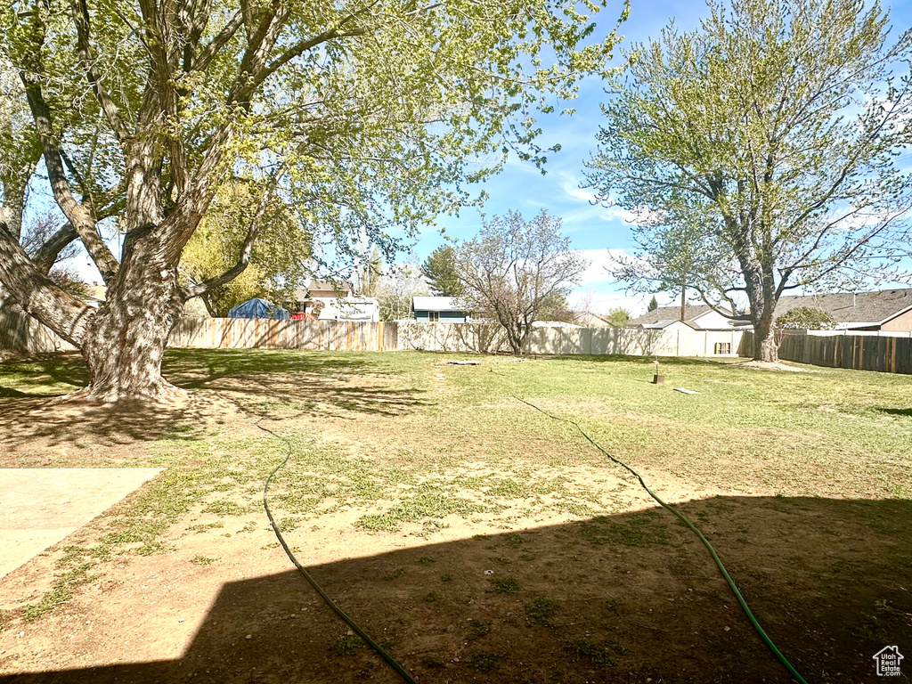 View of yard with a fenced backyard