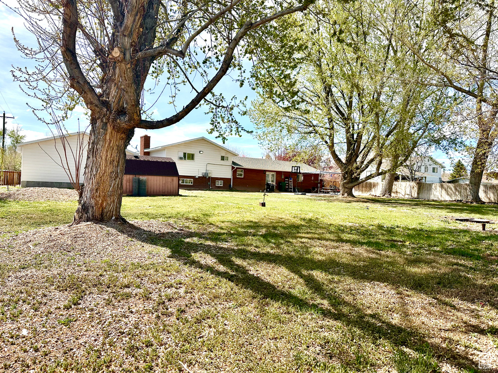 View of yard featuring fence