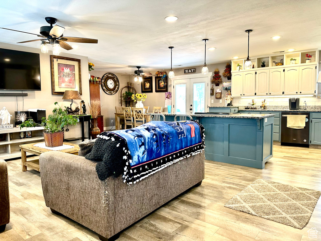 Living area featuring ceiling fan, french doors, recessed lighting, and light wood finished floors
