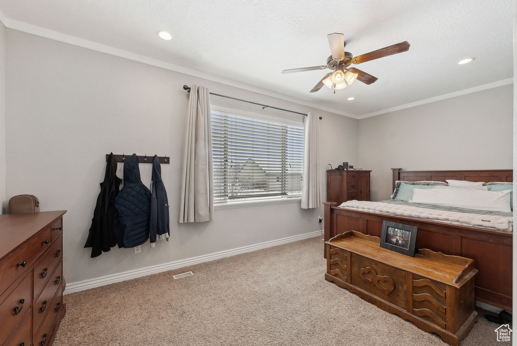 Bedroom with light carpet, ornamental molding, recessed lighting, and baseboards