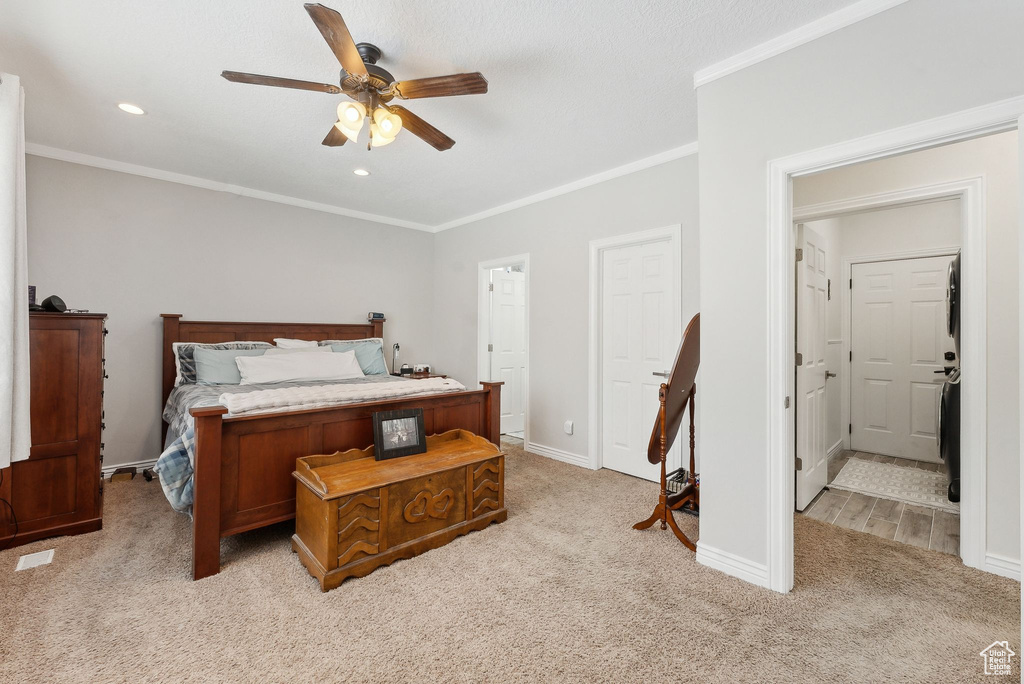 Bedroom with crown molding, recessed lighting, light colored carpet, ceiling fan, and baseboards