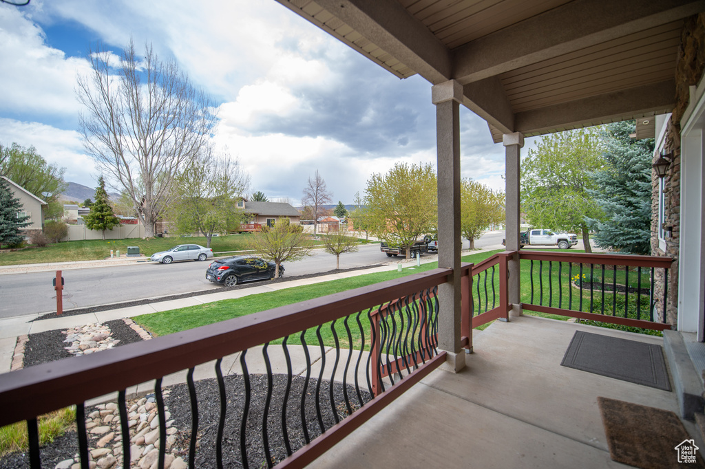 Balcony featuring a porch and a residential view