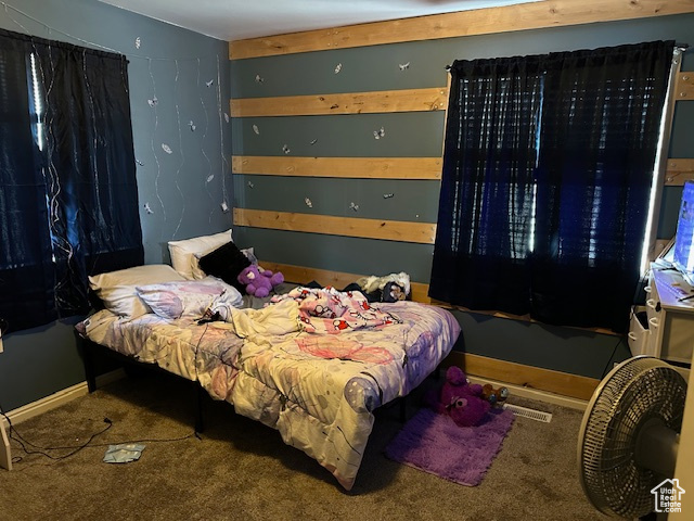 Carpeted bedroom with baseboards