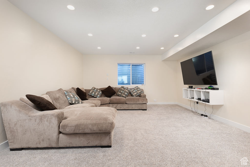 Living room with recessed lighting, carpet, and baseboards