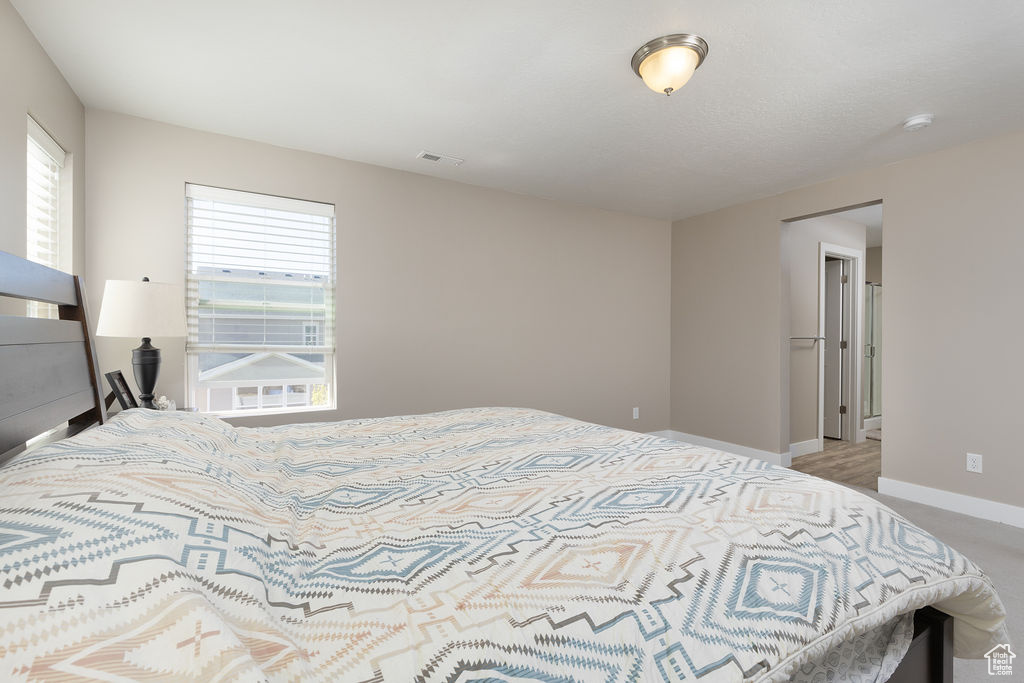 Bedroom featuring visible vents and baseboards