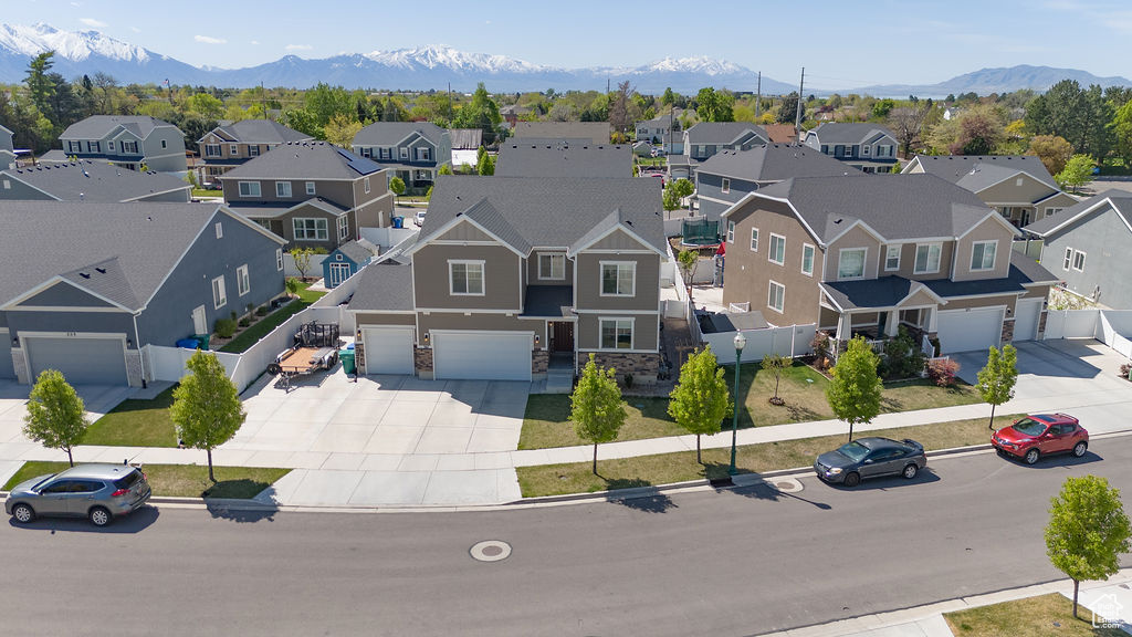 Drone / aerial view with a mountain view and a residential view