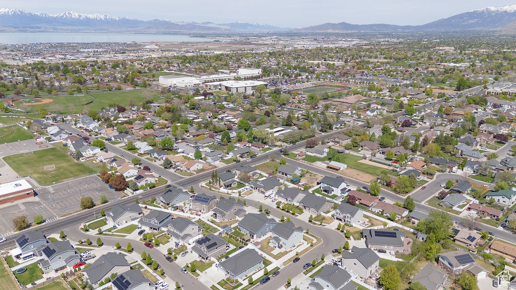 Drone / aerial view featuring a water and mountain view