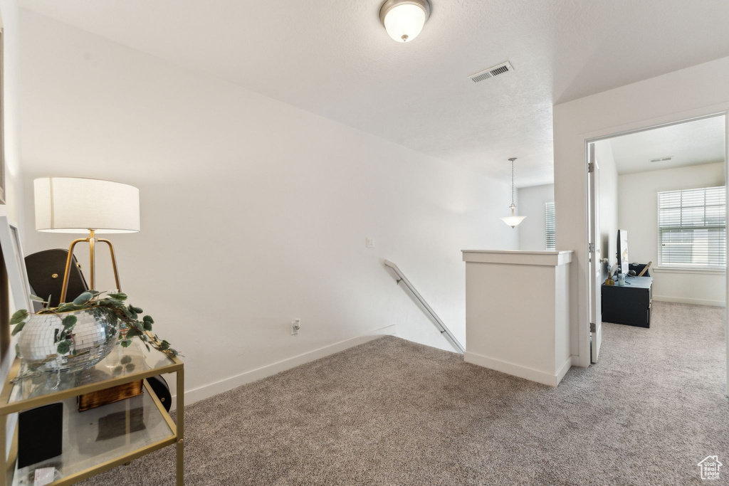 Interior space with visible vents and baseboards