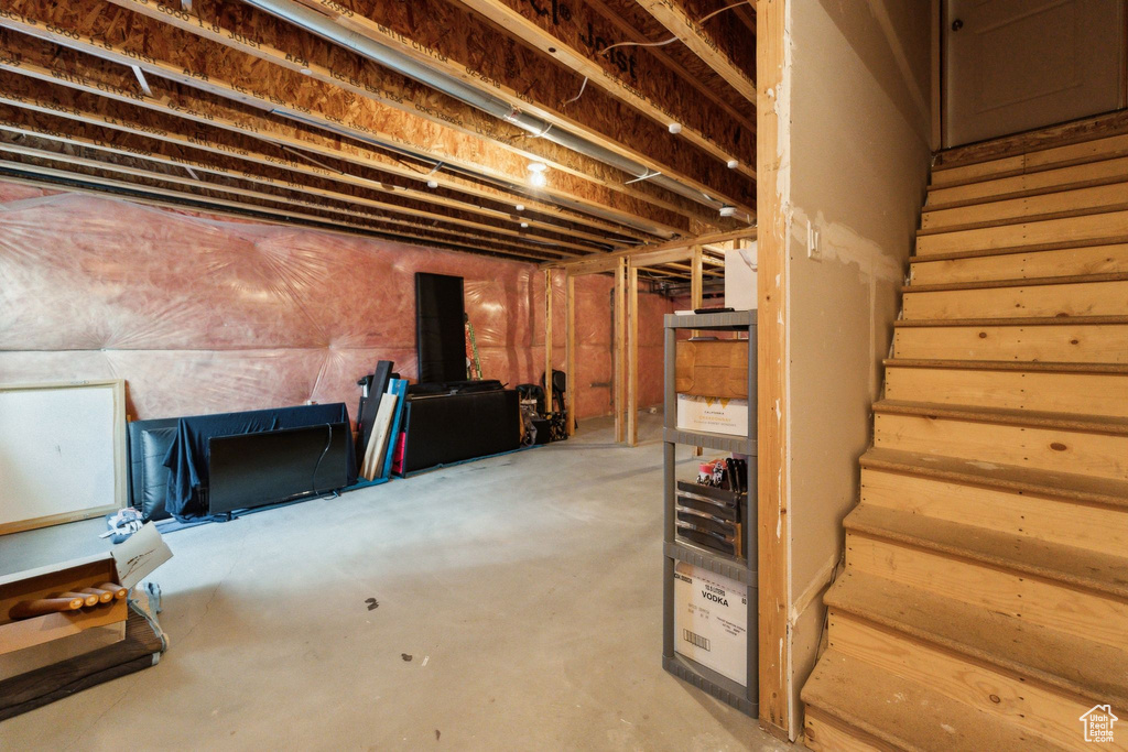 Unfinished basement featuring stairs