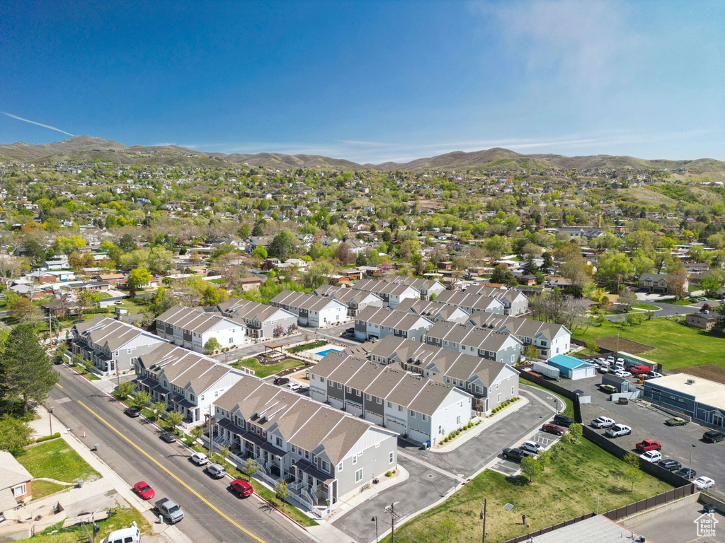 Birds eye view of property with a residential view and a mountain view