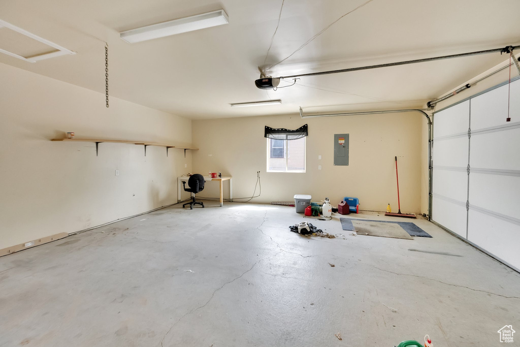 Garage with a garage door opener and electric panel
