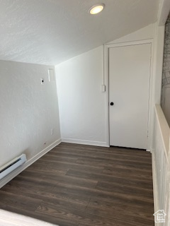 Unfurnished room with recessed lighting, wood finished floors, vaulted ceiling, baseboard heating, and baseboards