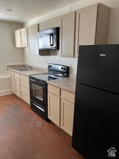 Kitchen featuring black appliances, baseboards, and light countertops