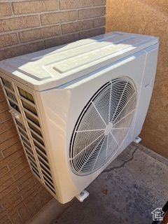 Exterior details featuring stucco siding and ac unit