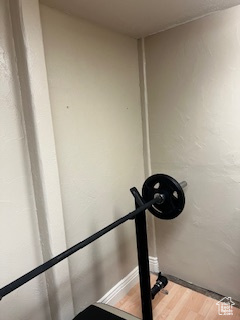 Workout room with wood finished floors