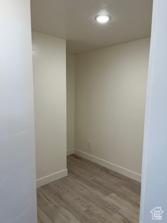 Spare room with wood finished floors, recessed lighting, and baseboards