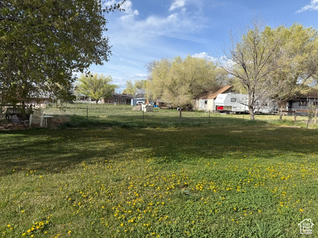 View of yard with fence