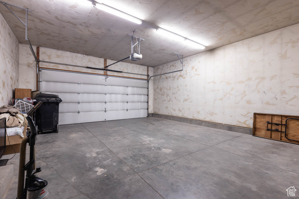 Garage featuring a garage door opener