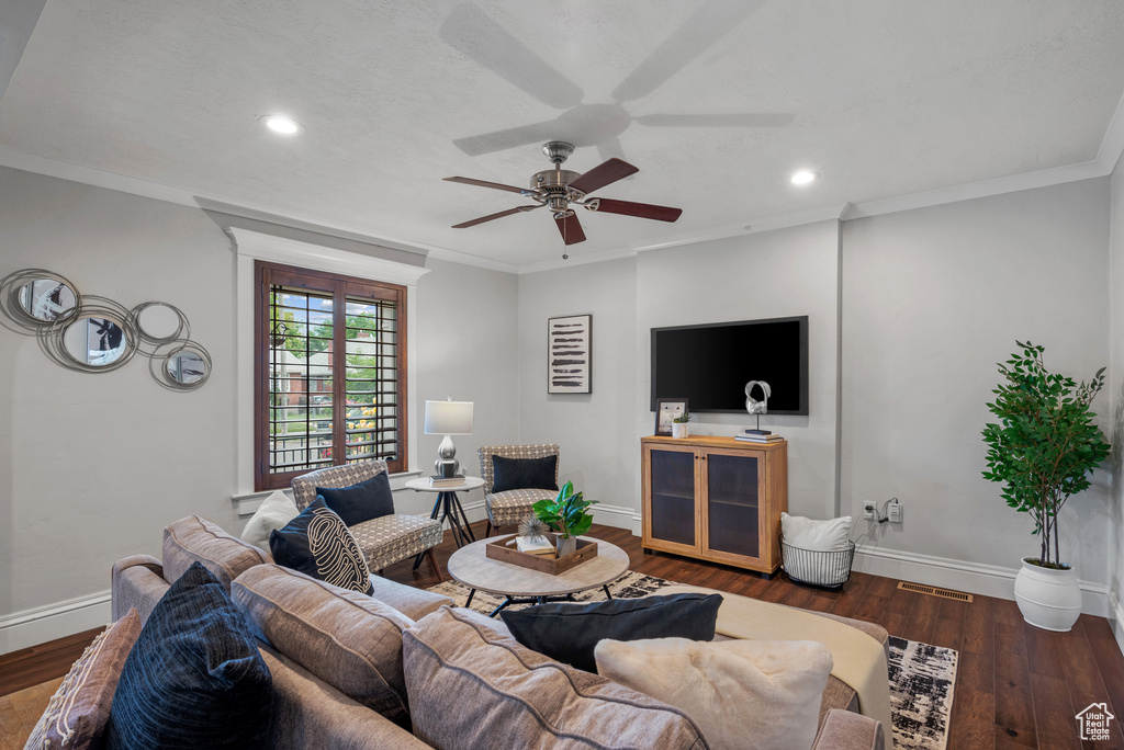 Living room with a ceiling fan, baseboards, recessed lighting, wood finished floors, and ornamental molding