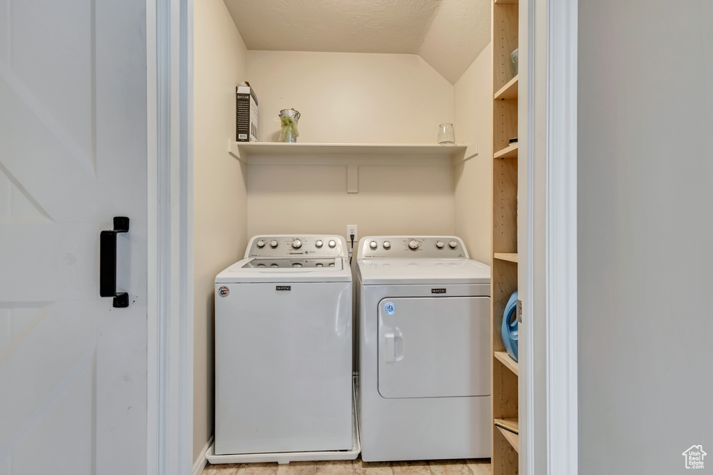 Laundry room featuring separate washer and dryer