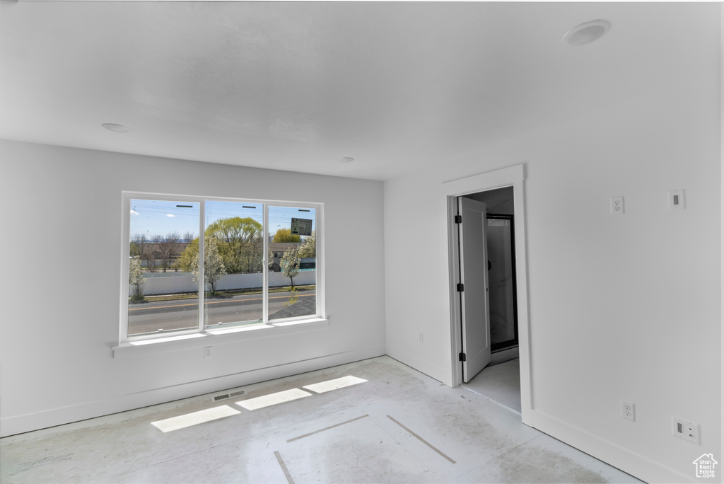 Unfurnished room featuring baseboards