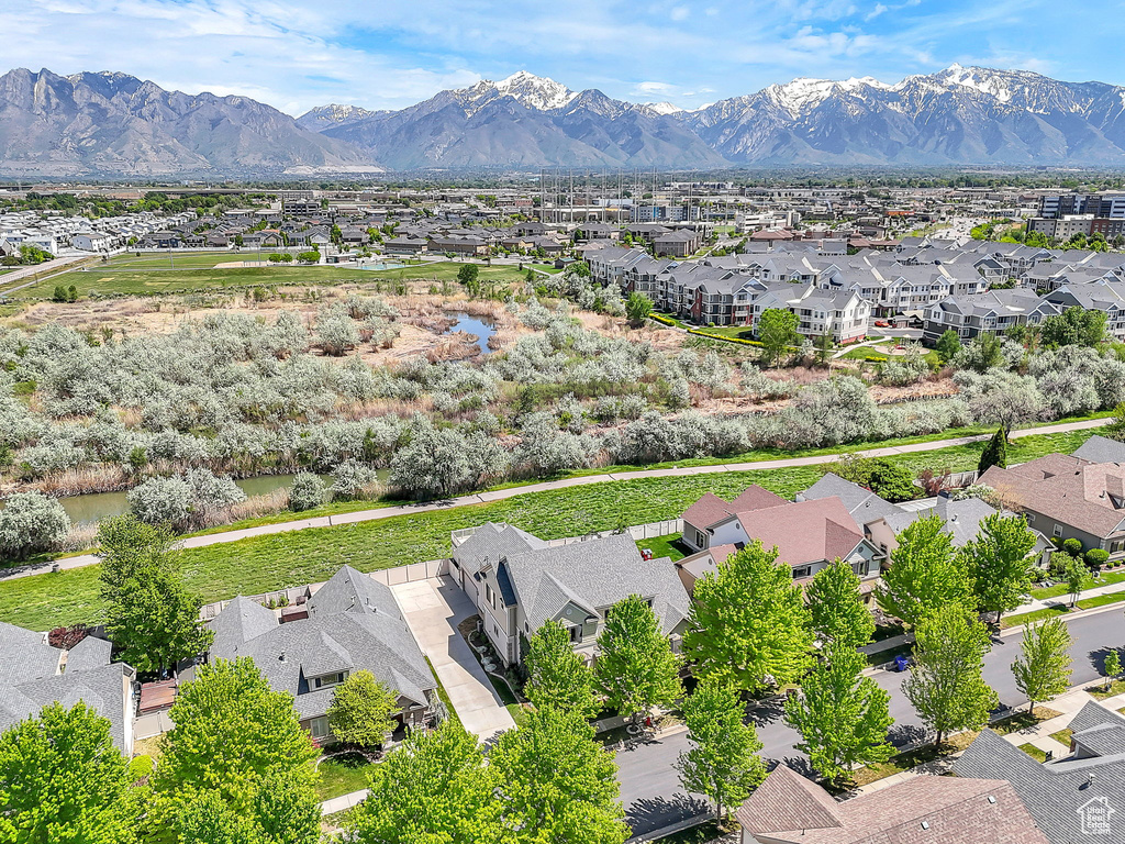 Aerial perspective of suburban area with a mountainous background