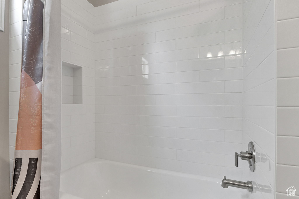 Full bathroom with shower / tub combo with curtain