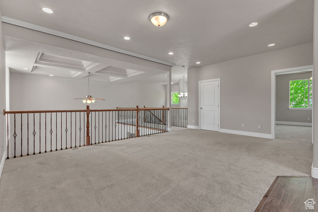 Spare room featuring ceiling fan, recessed lighting, healthy amount of natural light, carpet flooring, and coffered ceiling