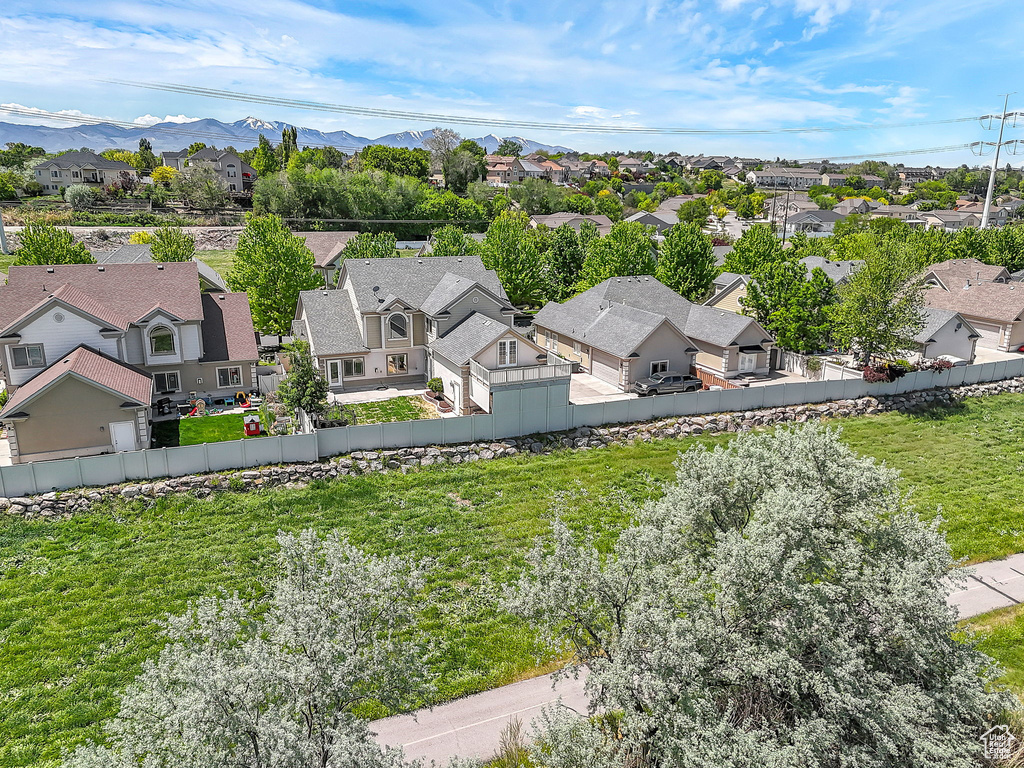 Aerial view of residential area featuring mountains