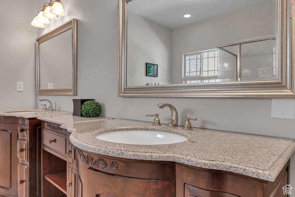 Bathroom featuring vanity and recessed lighting