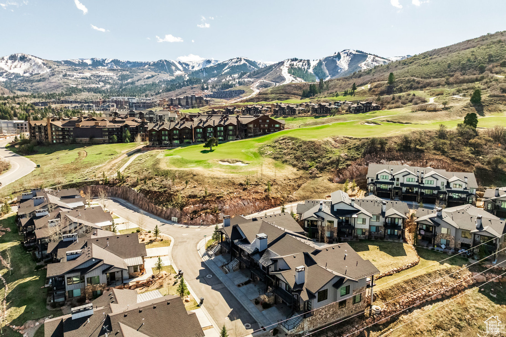 Birds eye view of property featuring golf course view, a mountain view, and a residential view