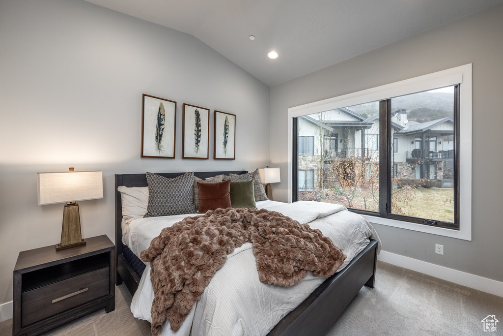 Carpeted bedroom with recessed lighting, vaulted ceiling, and baseboards