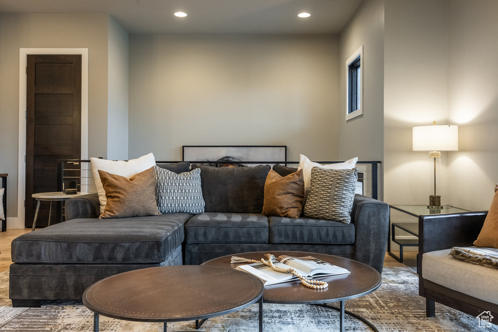 Living room with recessed lighting and wood finished floors