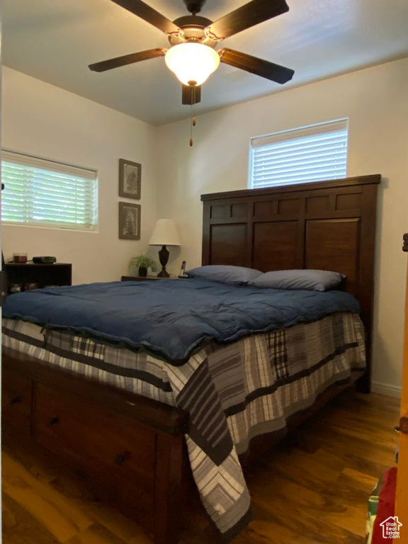 Bedroom with wood finished floors and ceiling fan