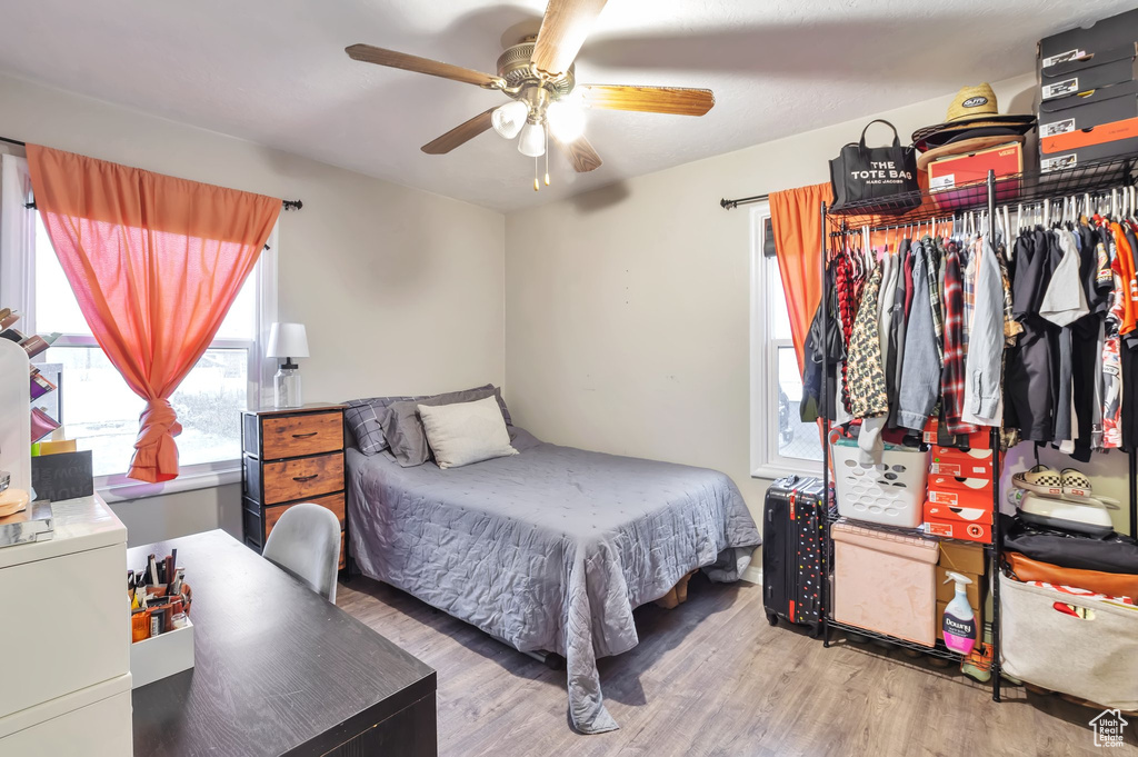 Bedroom featuring wood finished floors and ceiling fan
