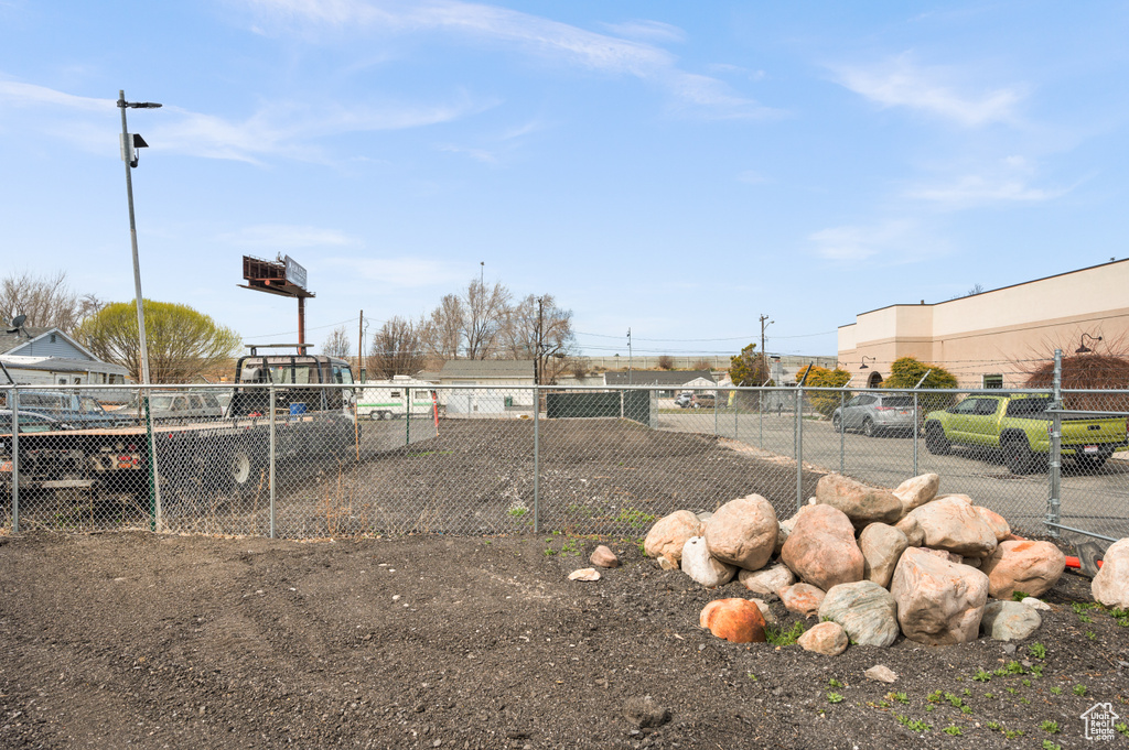 View of yard featuring fence
