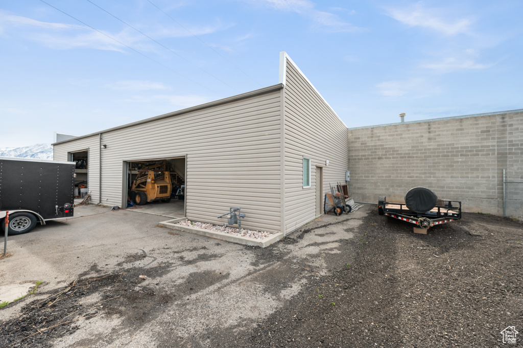 View of outbuilding featuring a garage
