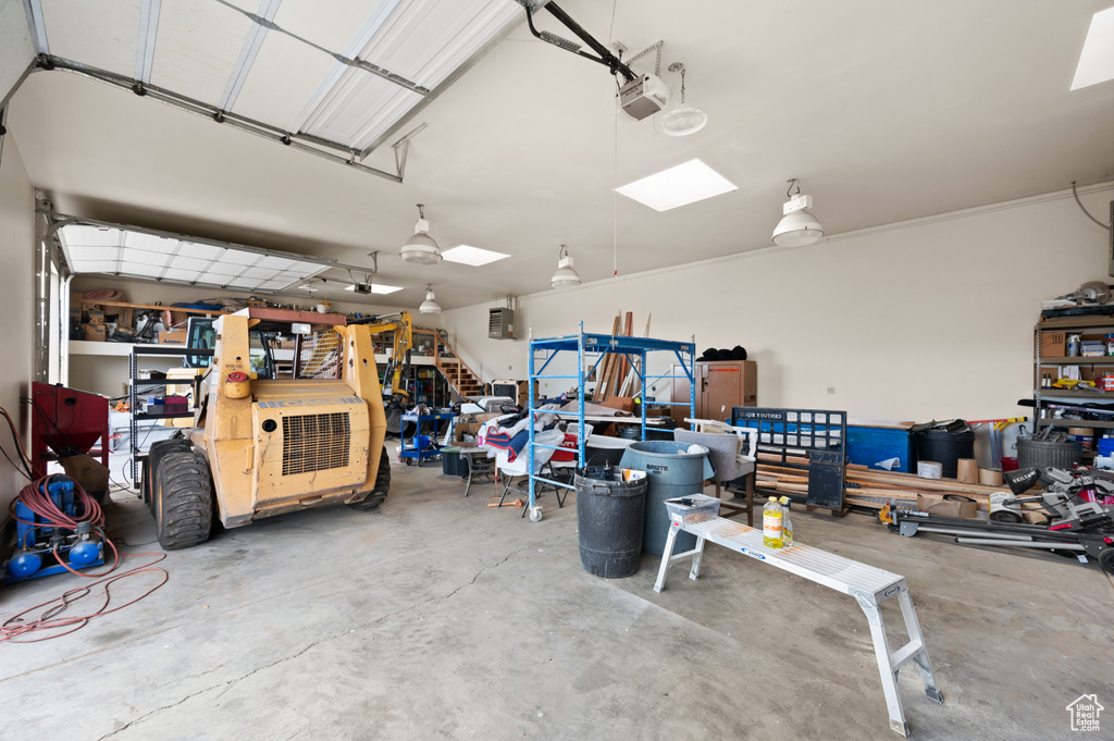 Garage featuring a garage door opener