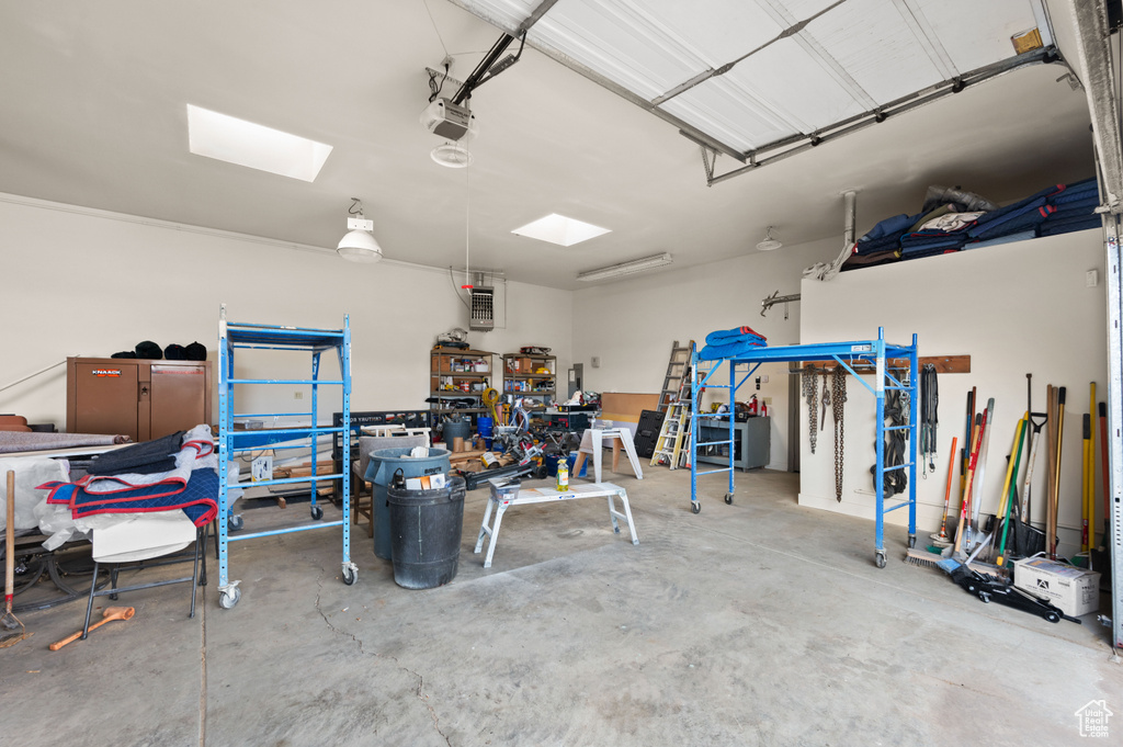 Garage featuring a garage door opener