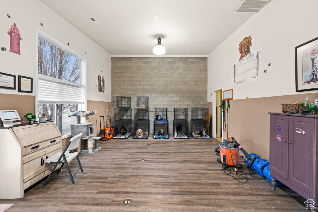 Interior space with visible vents and wood finished floors