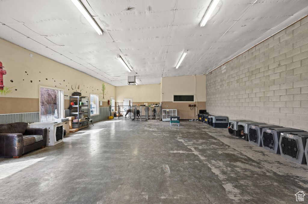 Garage featuring concrete block wall