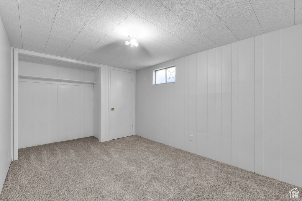 Unfurnished bedroom with carpet and a closet