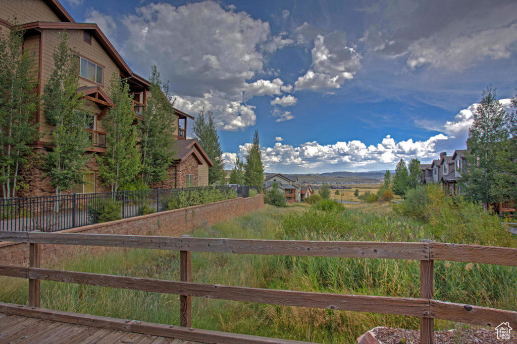 View of yard featuring fence