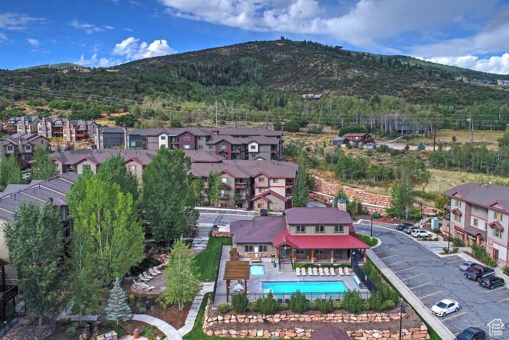 Birds eye view of property with a residential view and a mountain view