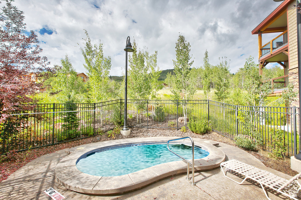 View of swimming pool with a fenced backyard