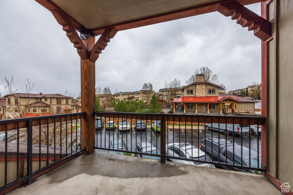 Balcony with a residential view and a water view