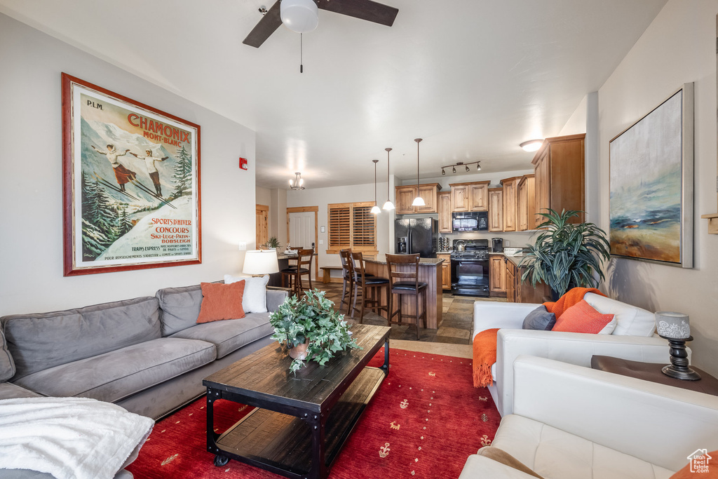 Living area featuring ceiling fan