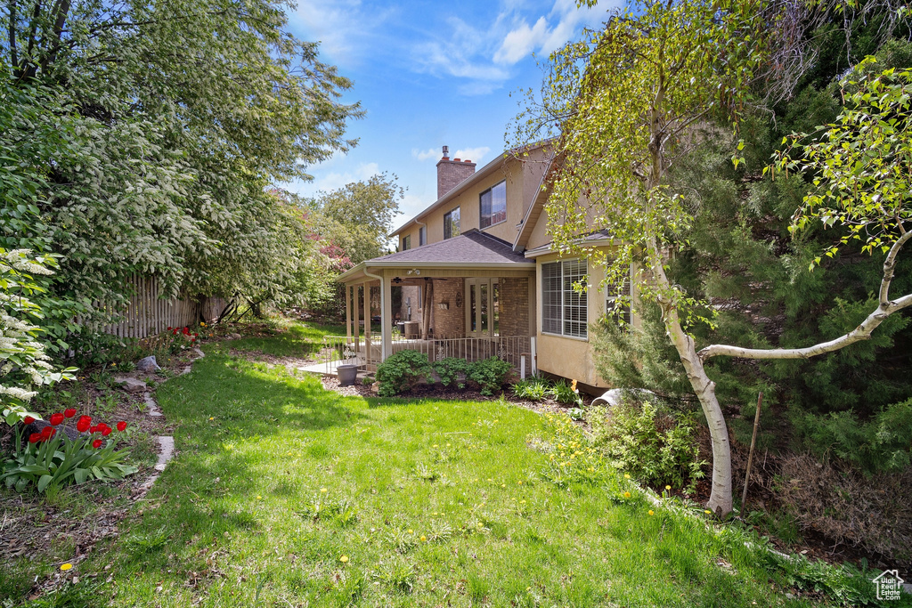 View of yard with fence